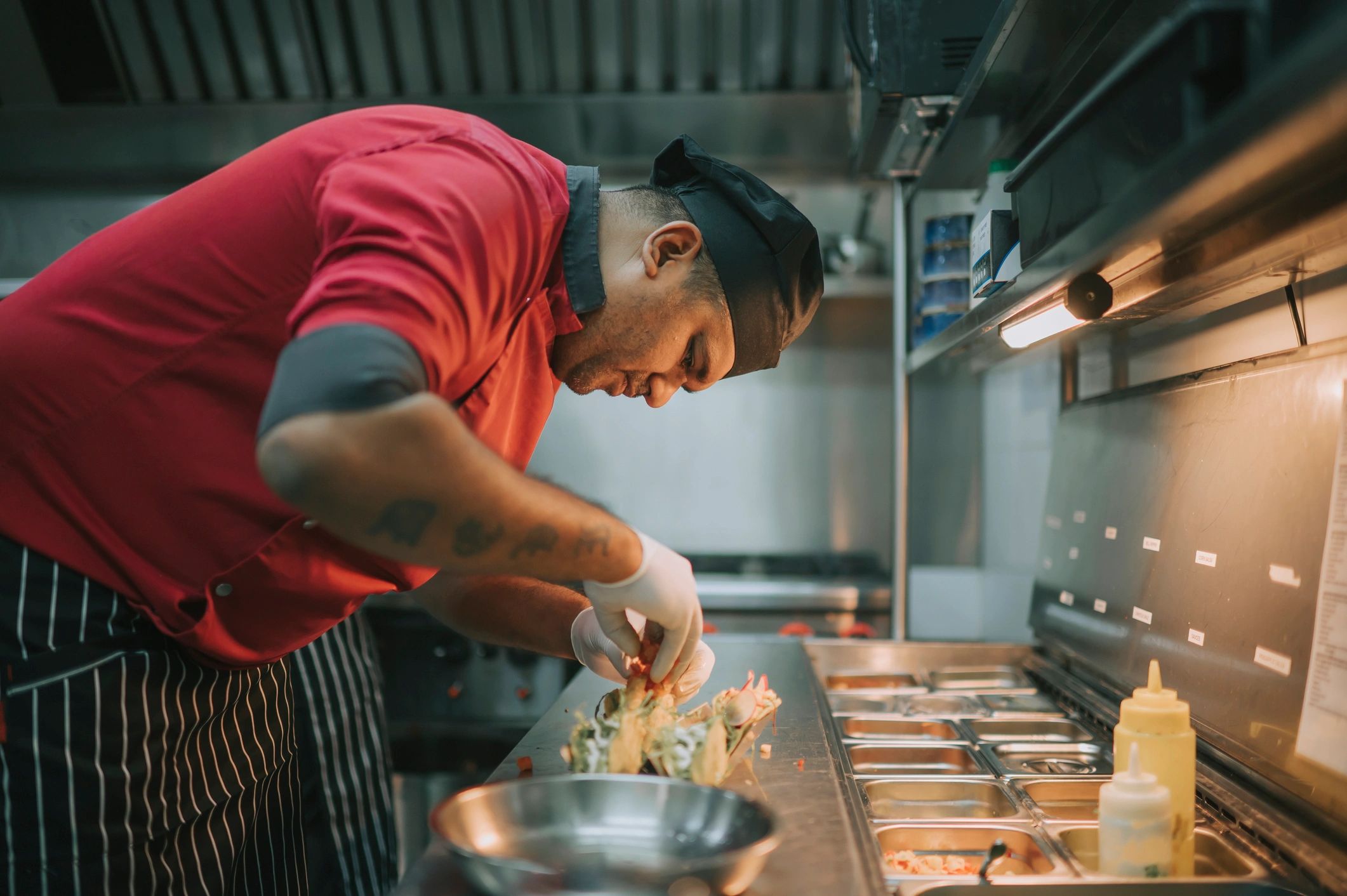 Mexican chef preparing tacos